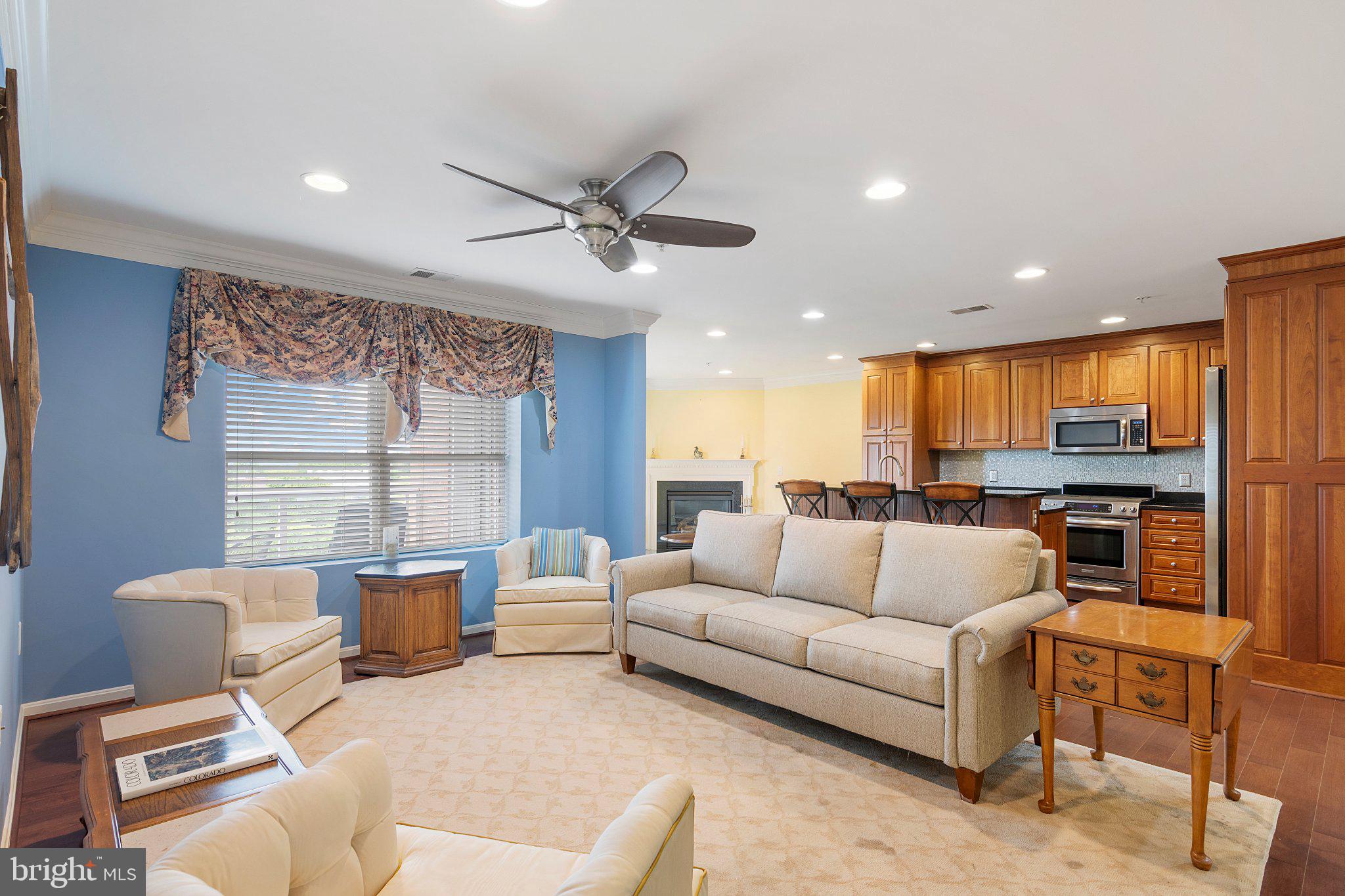 12236 Roundwood Road, Unit 609 Lutherville-Timonium, MD 21093 - Photo 8 of 40 a living room with furniture and a large window