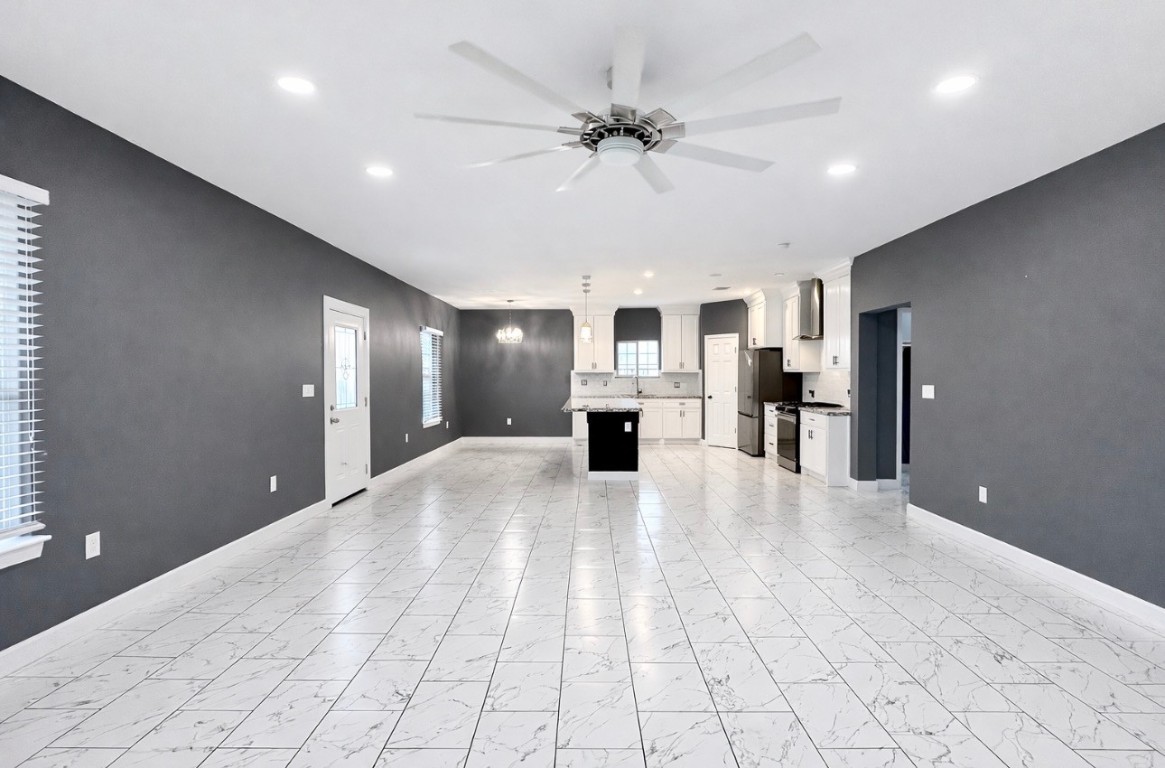 5125 Larkspur Street Houston, TX 77033 - Photo 11 of 33 a view of livingroom with kitchen view and a window