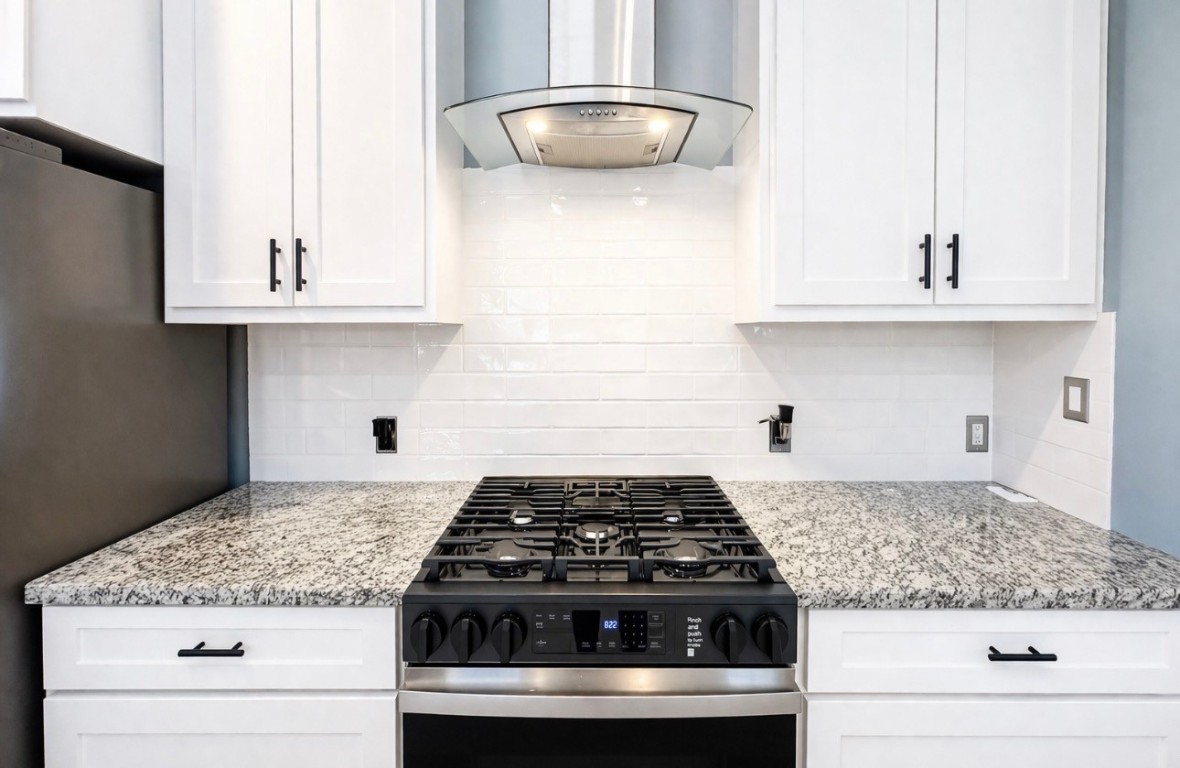 5125 Larkspur Street Houston, TX 77033 - Photo 14 of 33 a white stove top oven sitting inside of a kitchen