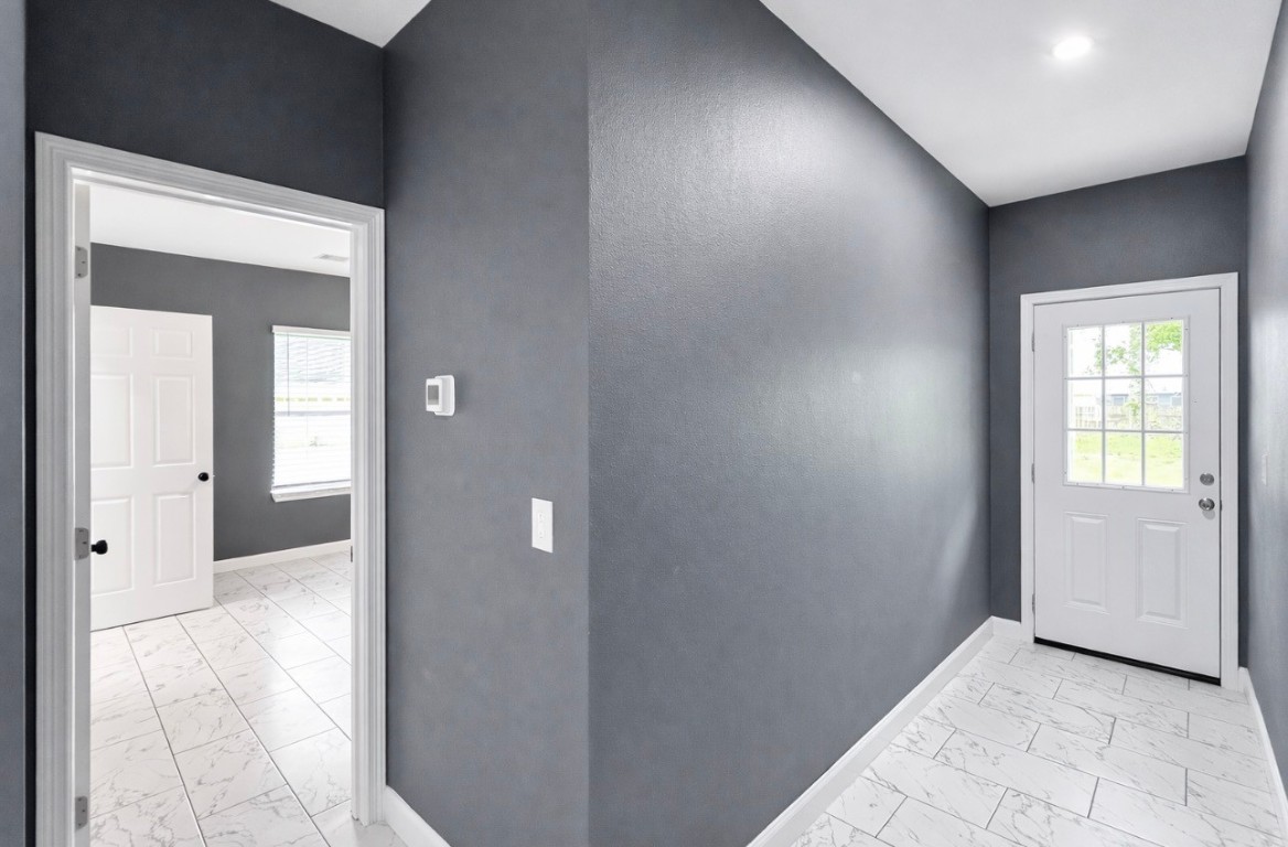 5125 Larkspur Street Houston, TX 77033 - Photo 24 of 33 a view of a hallway with wooden floor