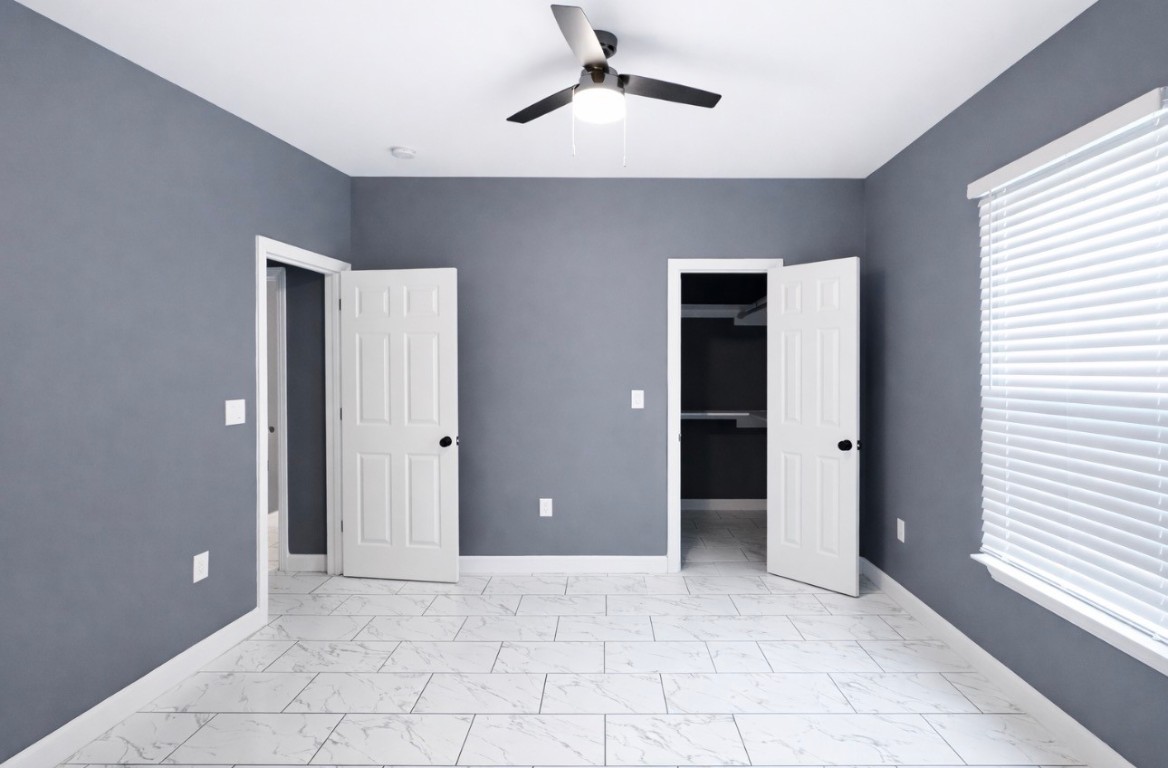 5125 Larkspur Street Houston, TX 77033 - Photo 25 of 33 a view of an empty room with window and closet area