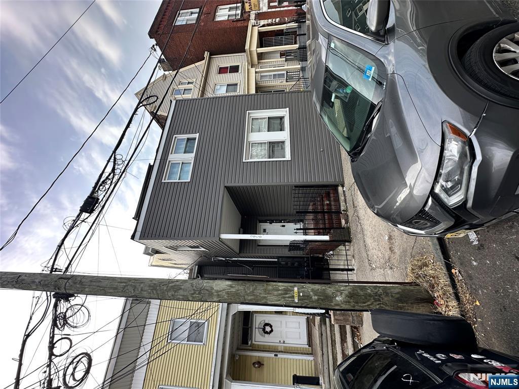 276 Ellison Street Paterson, NJ 07501 - Photo 1 of 22 a front view of a house