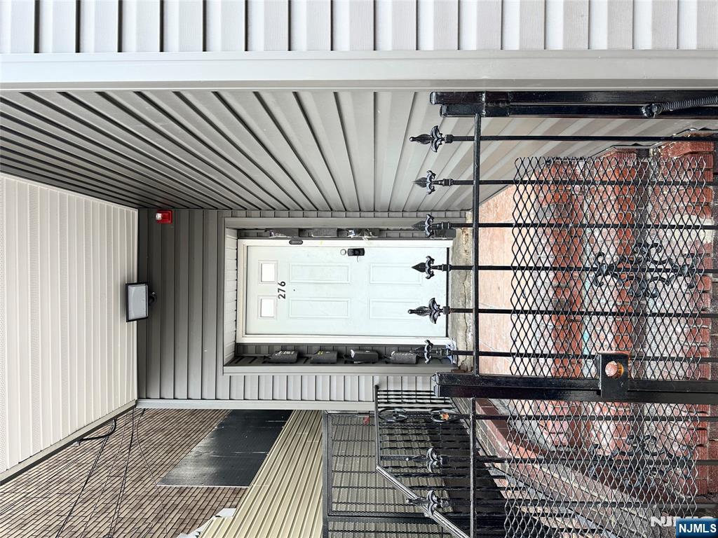 276 Ellison Street Paterson, NJ 07501 - Photo 15 of 22 a view of a balcony with chairs