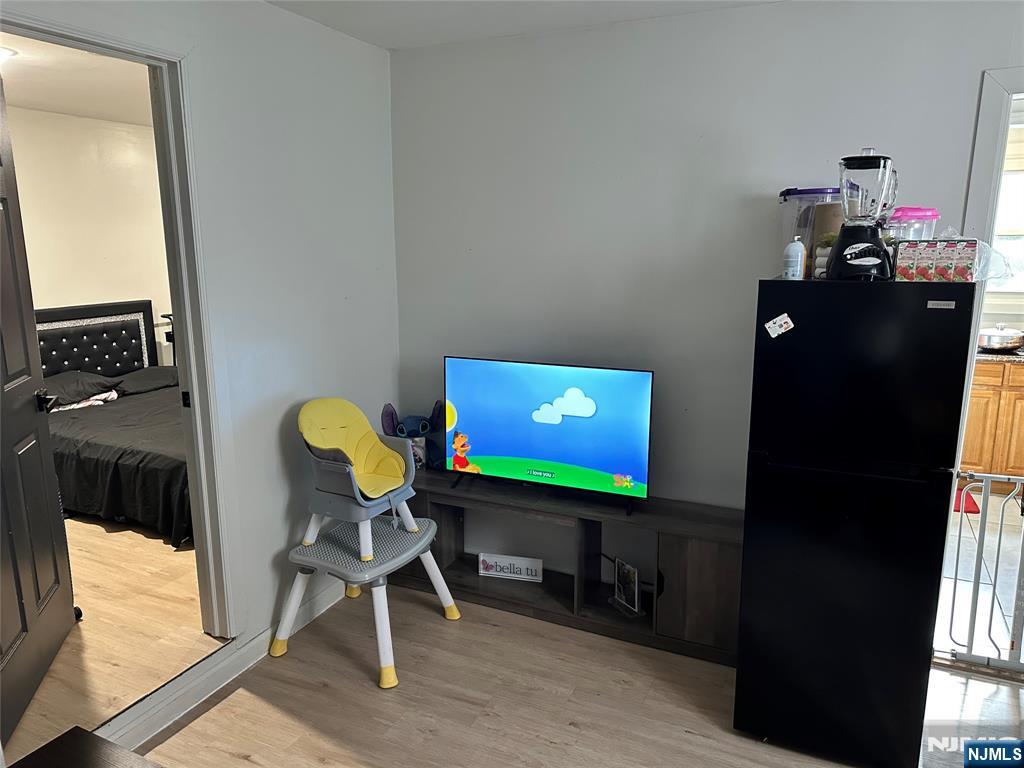 276 Ellison Street Paterson, NJ 07501 - Photo 20 of 22 a living room with furniture and a flat screen tv