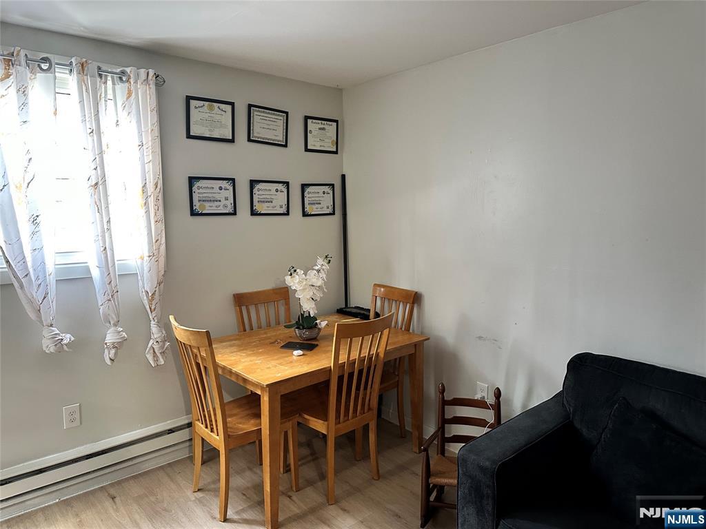 276 Ellison Street Paterson, NJ 07501 - Photo 21 of 22 a view of a dining room with furniture