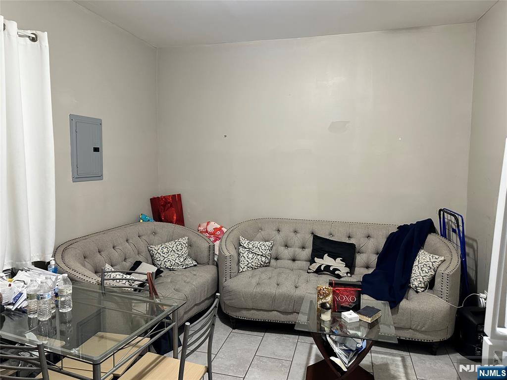 276 Ellison Street Paterson, NJ 07501 - Photo 7 of 22 a living room with furniture