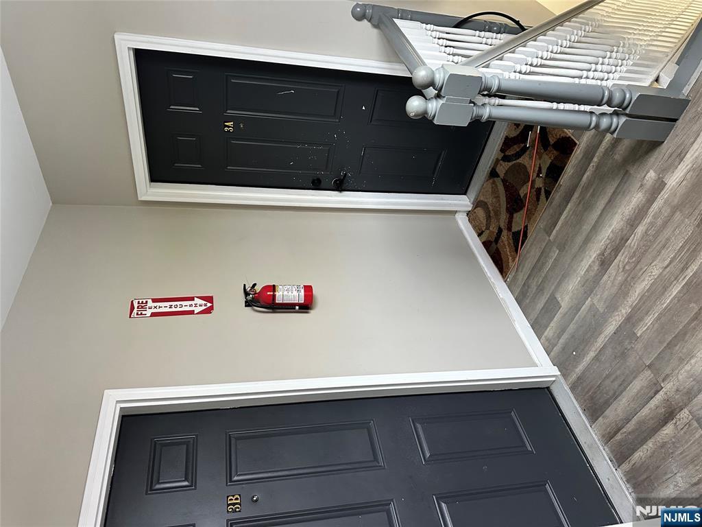 276 Ellison Street Paterson, NJ 07501 - Photo 10 of 22 a bedroom with a bed and a dresser