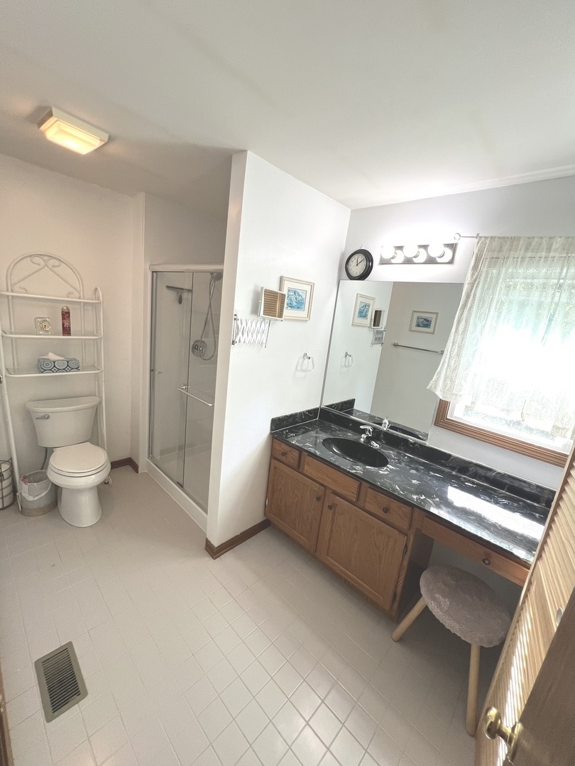 1018 Rain Tree Drive Bolingbrook, IL 60440 - Photo 13 of 22 a kitchen with stainless steel appliances granite countertop a stove and a refrigerator