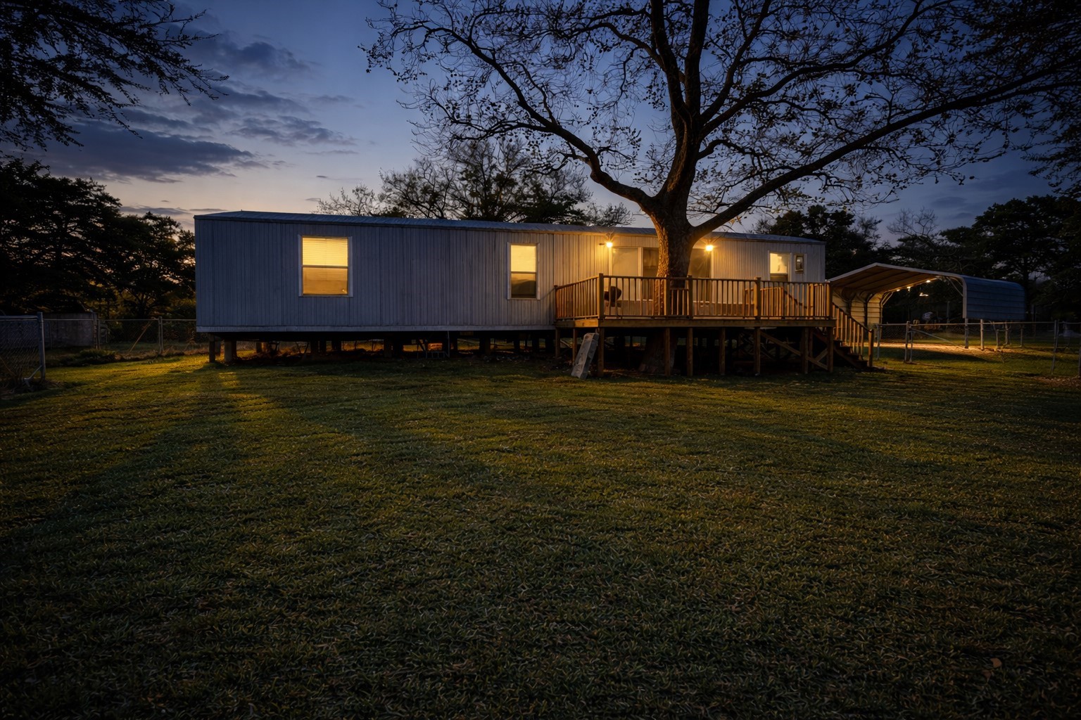 a view of a backyard with large trees