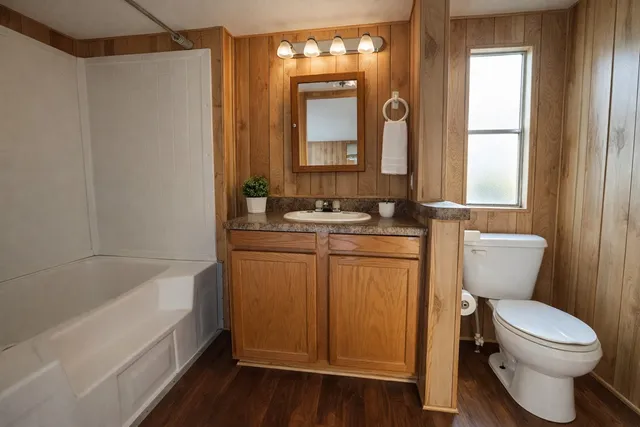 a bathroom with a sink a toilet and a bathtub