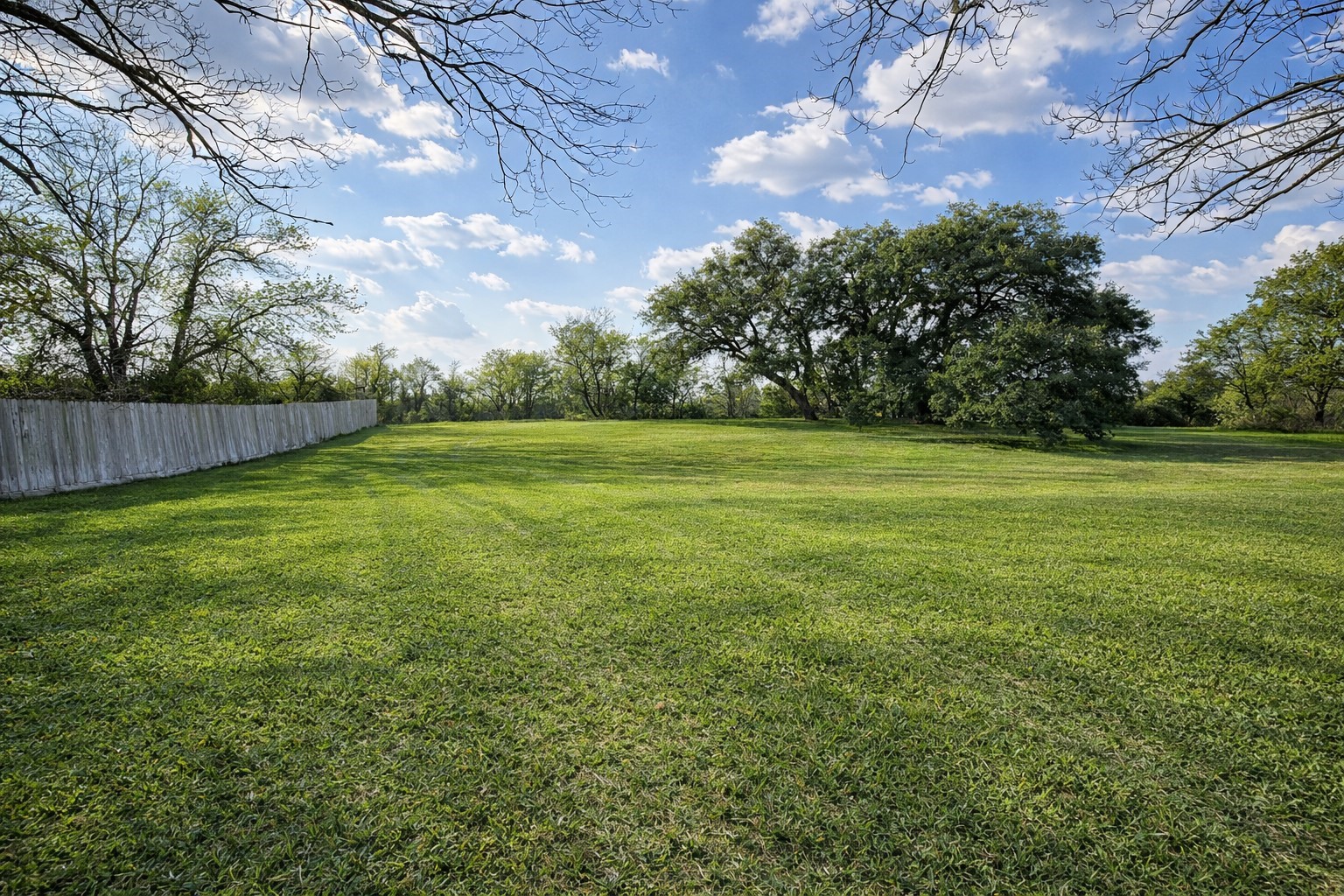 1037 Pecan Valley Road Wharton, TX 77488 - Photo 16 of 17 a view of a big yard with a house