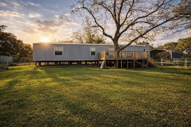 a view of a house with a big yard