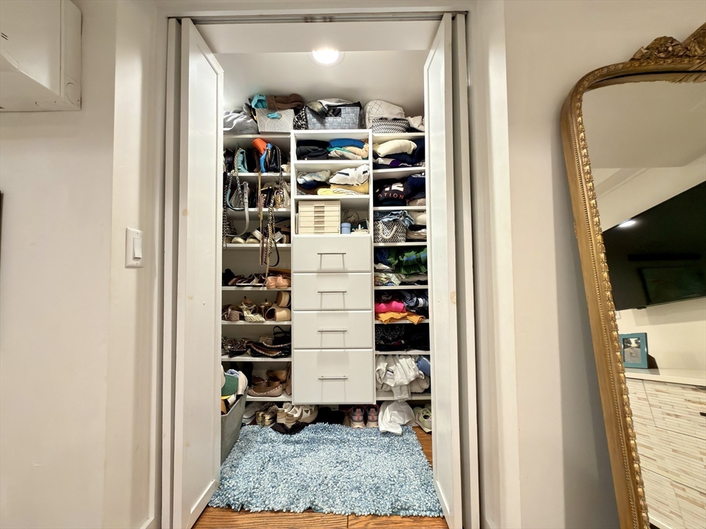 41 Pinckney Street, Unit B Boston, MA 02114 - Photo 11 of 31 a room with a walk in closet and a window