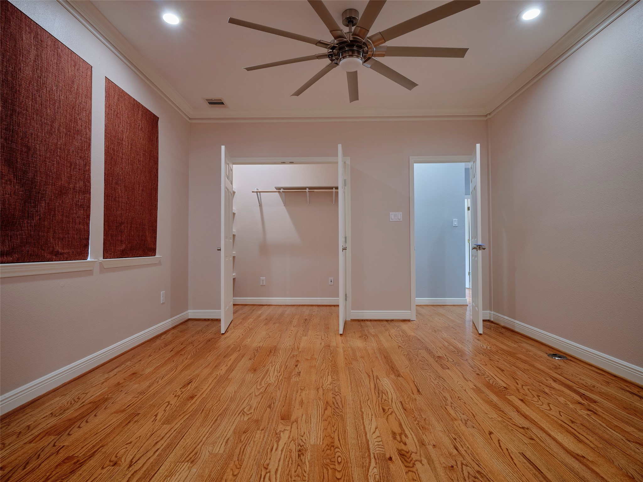 4219 Redbud Street Houston, TX 77051 - Photo 4 of 25 Discover the versatile flex room on the second floor, featuring warm hardwood floors, ample natural light, and a spacious closet—perfect for a home office, playroom, or guest suite.