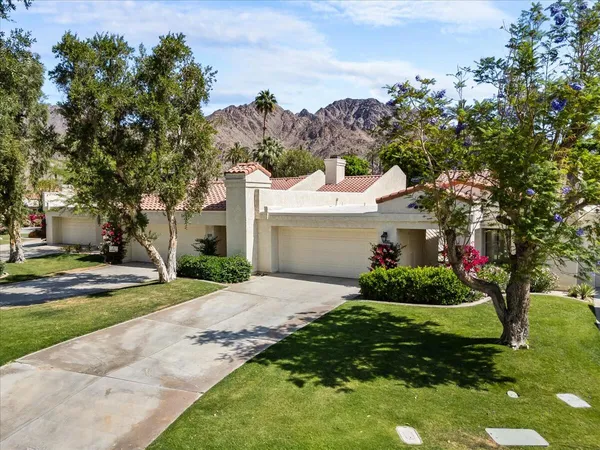 a bathroom with a sink a vanity and a mirror