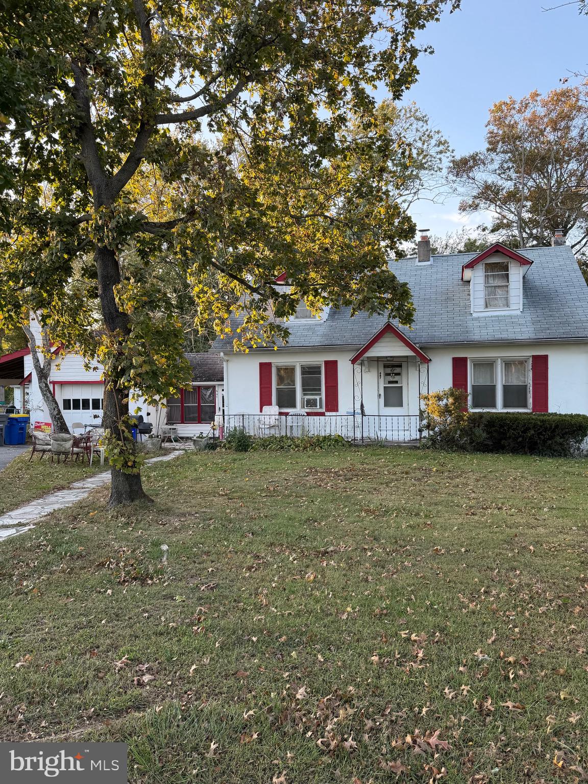 647 Highway 45 Mannington, NJ 08079 - Photo 1 of 16 a front view of a house with a garden
