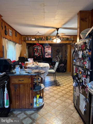 a room with furniture toys and a large window