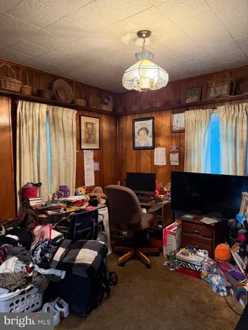 a bathroom with a granite countertop bathtub shower sink vanity and toilet