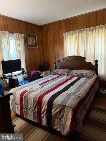 a bedroom with a bed and a closet