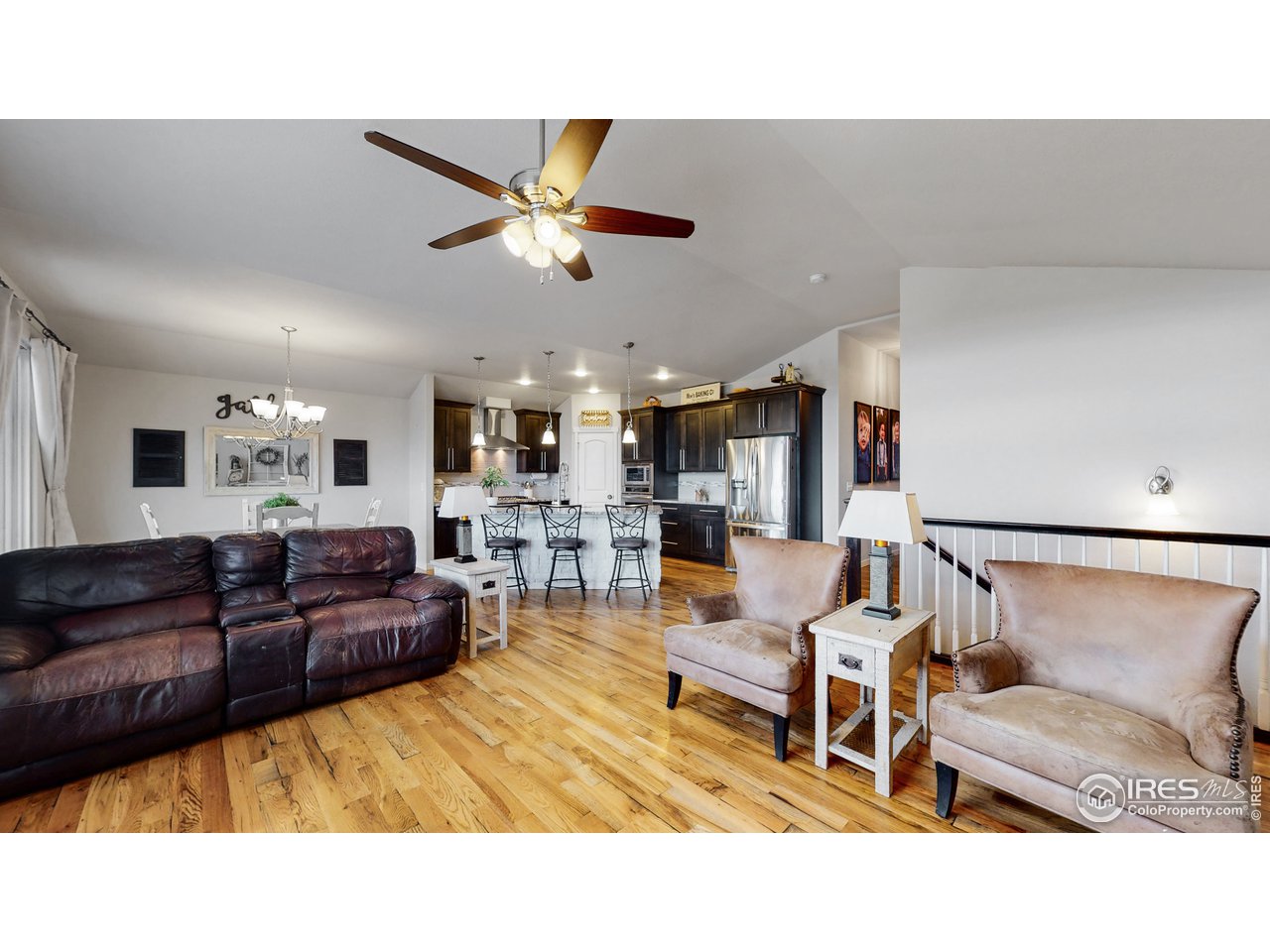 640 Rock Road Eaton, CO 80615 - Photo 11 of 33 Living room and dining room and kitchen in an open concept