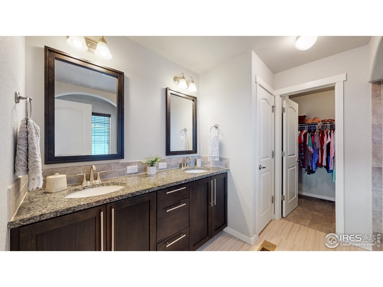 640 Rock Road Eaton, CO 80615 - Photo 15 of 33 Double sinks, and beautiful tile floors
