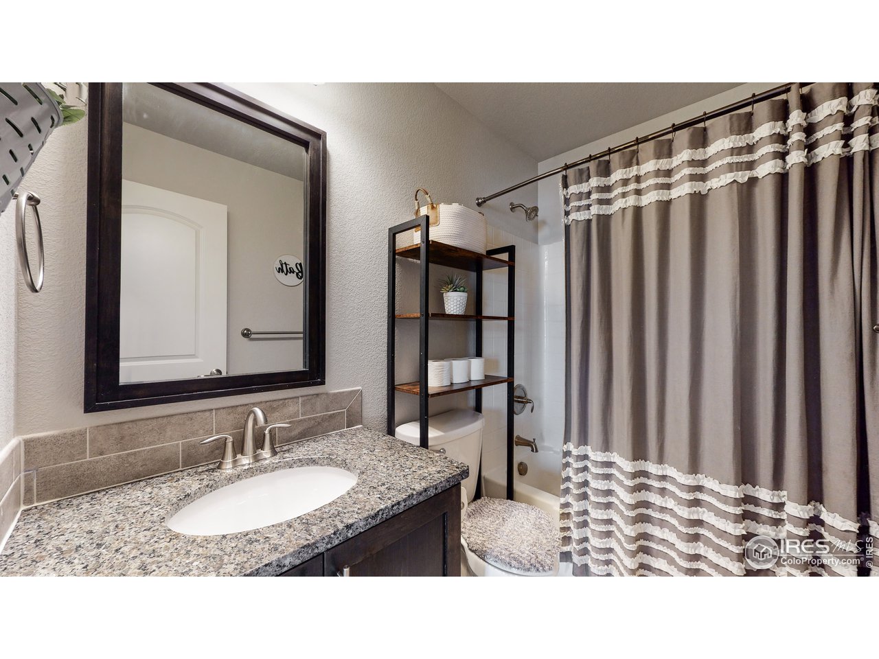 640 Rock Road Eaton, CO 80615 - Photo 20 of 33 Secondary hall bathroom has granite counter and undermount sink