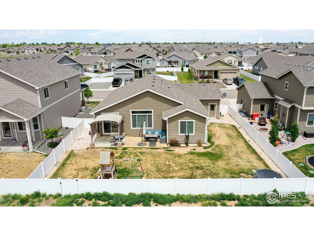 640 Rock Road Eaton, CO 80615 - Photo 31 of 33 Fully fenced with white vinyl fencing.