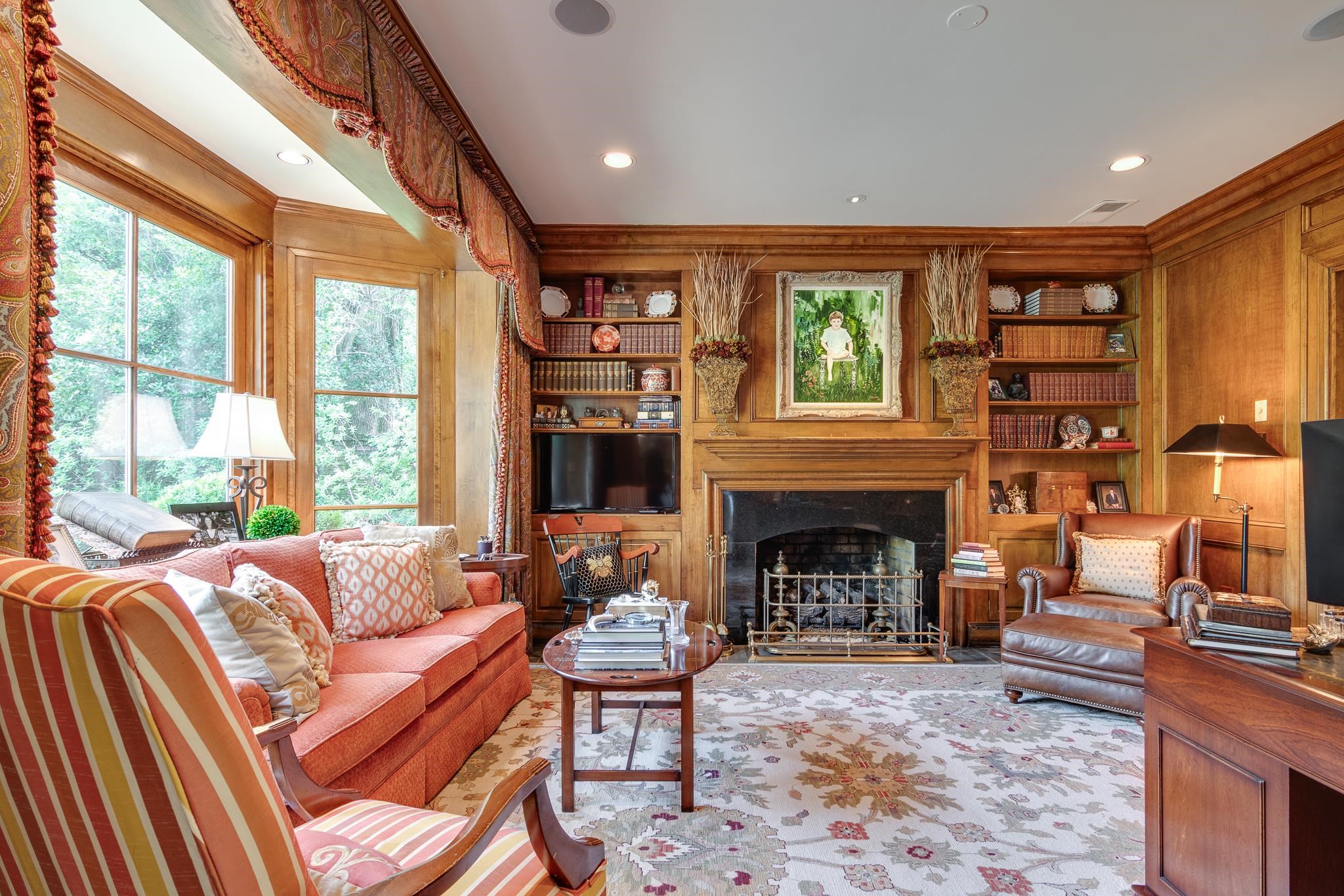 54 South Rose Road Memphis, TN 38117 - Photo 13 of 40 a living room with furniture a fireplace and a large window