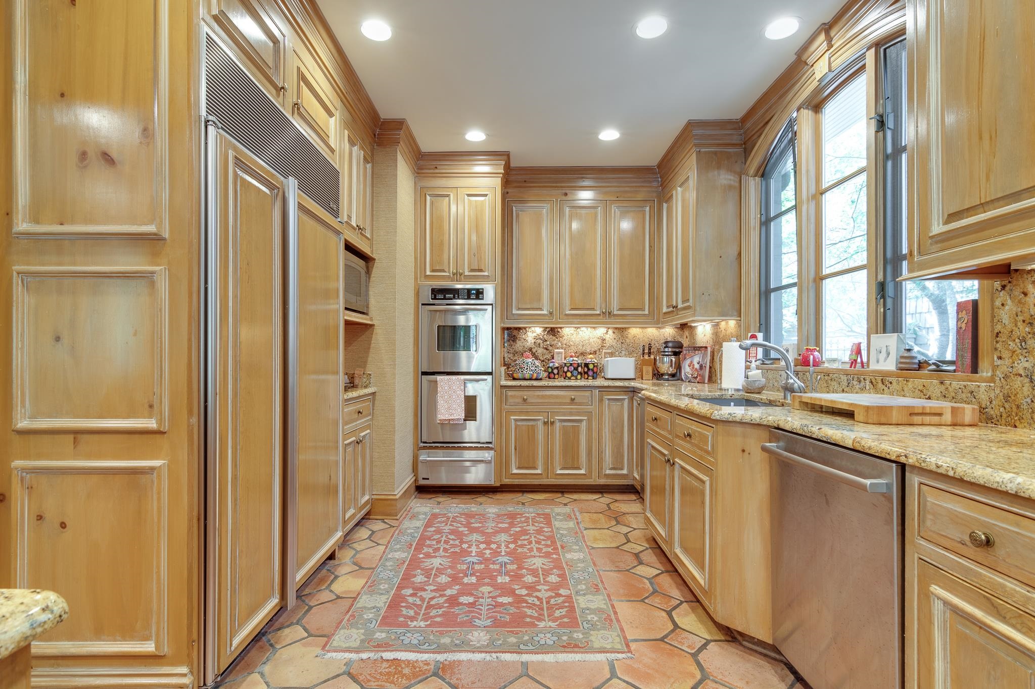 54 South Rose Road Memphis, TN 38117 - Photo 21 of 40 a kitchen with stainless steel appliances granite countertop a refrigerator and sink