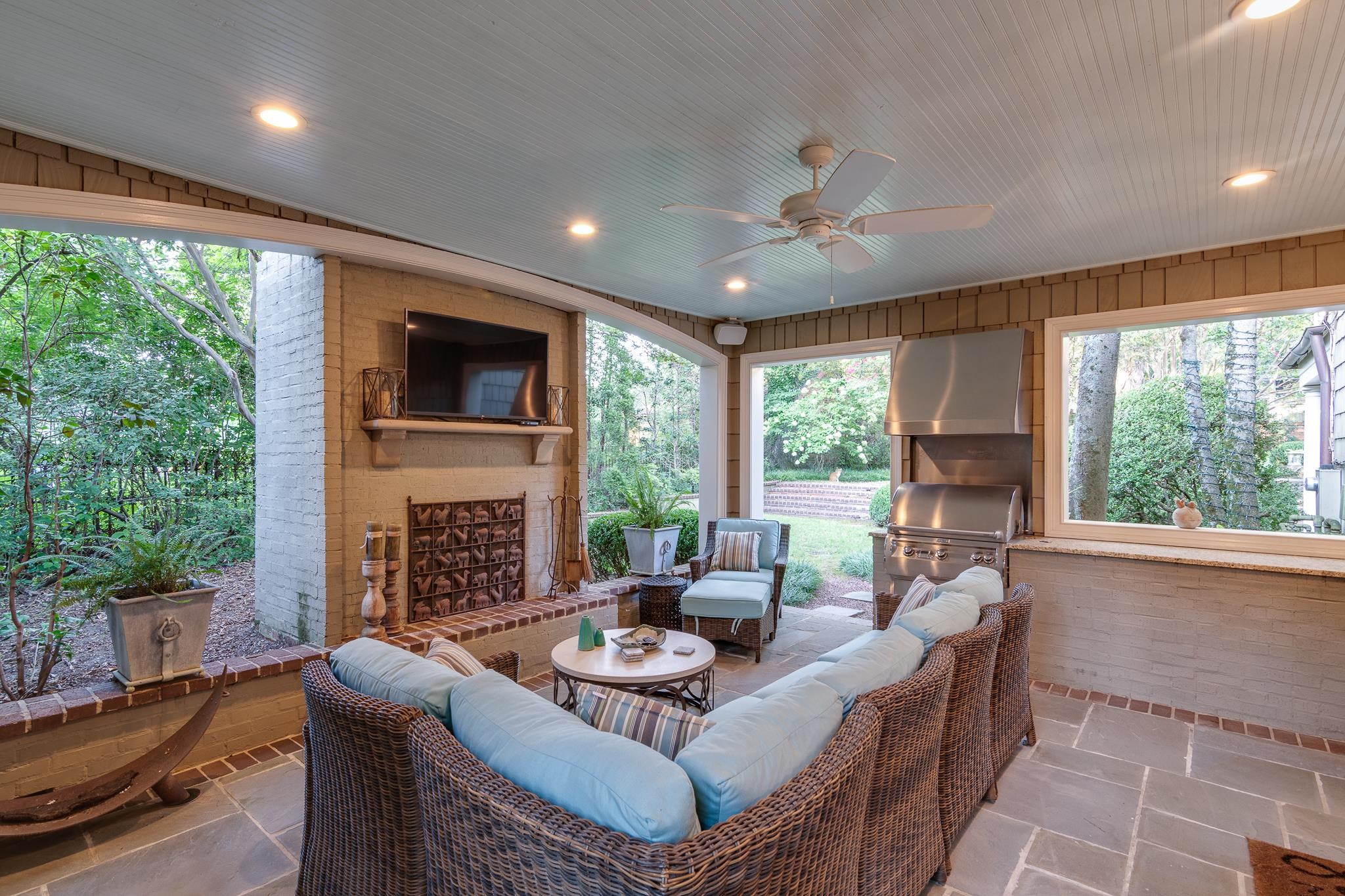 54 South Rose Road Memphis, TN 38117 - Photo 3 of 40 a living room with furniture a fireplace and a large window