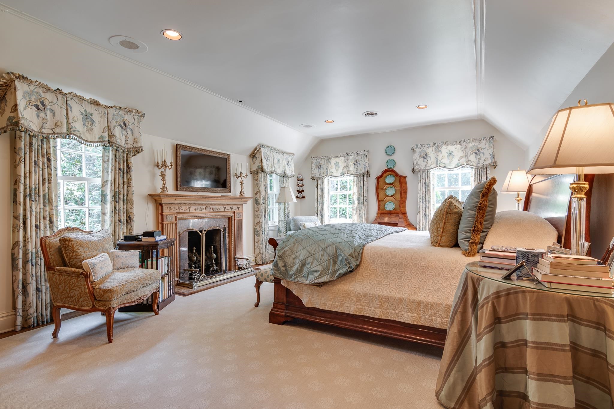 54 South Rose Road Memphis, TN 38117 - Photo 34 of 40 a bedroom with a bed and a fireplace