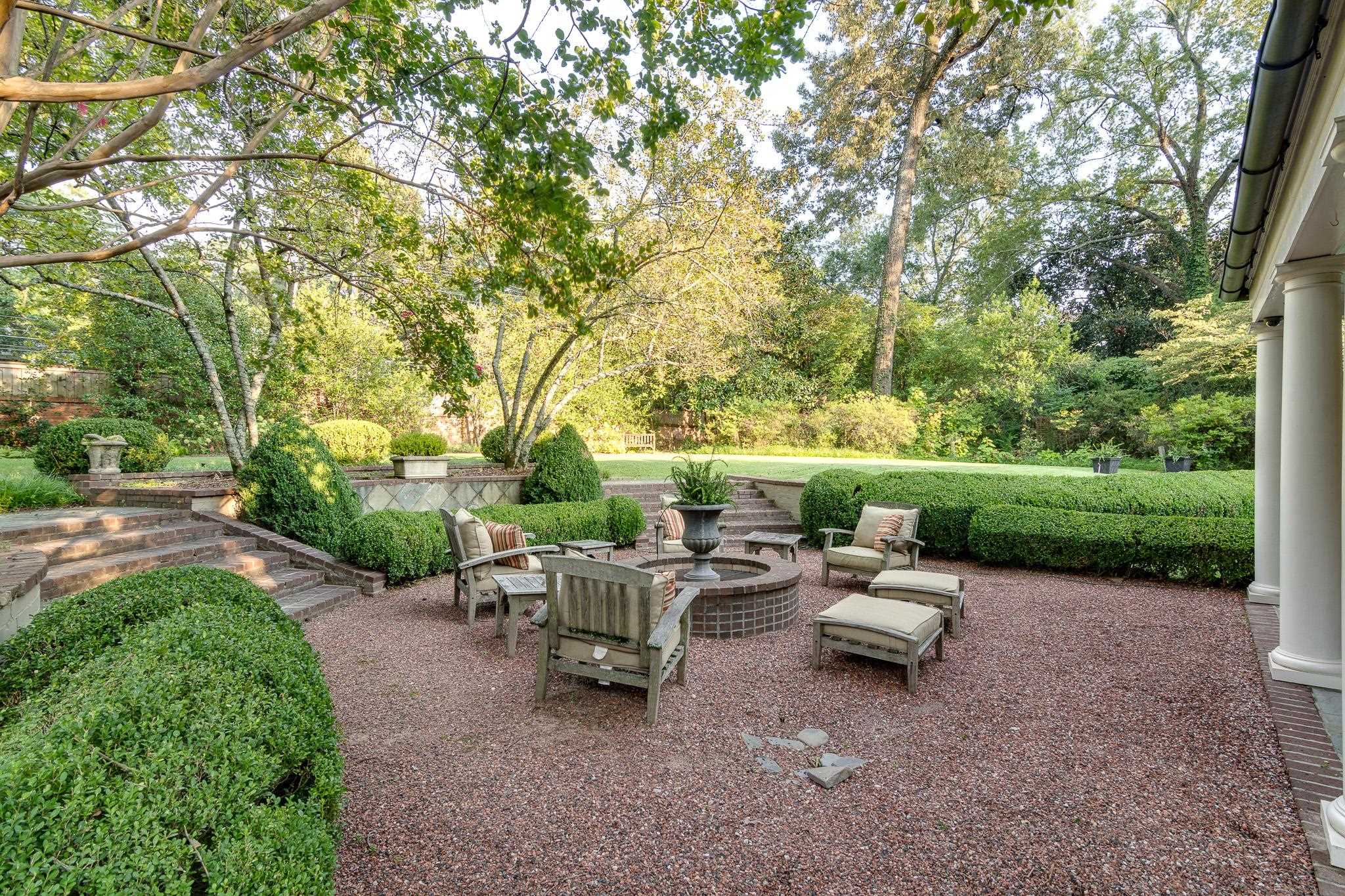 54 South Rose Road Memphis, TN 38117 - Photo 6 of 40 a view of a patio with table and chairs potted plants and a large tree