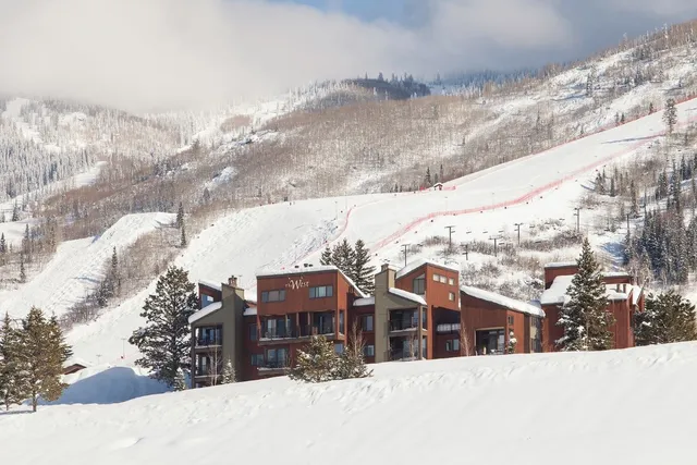 a view of houses with a snow in the background