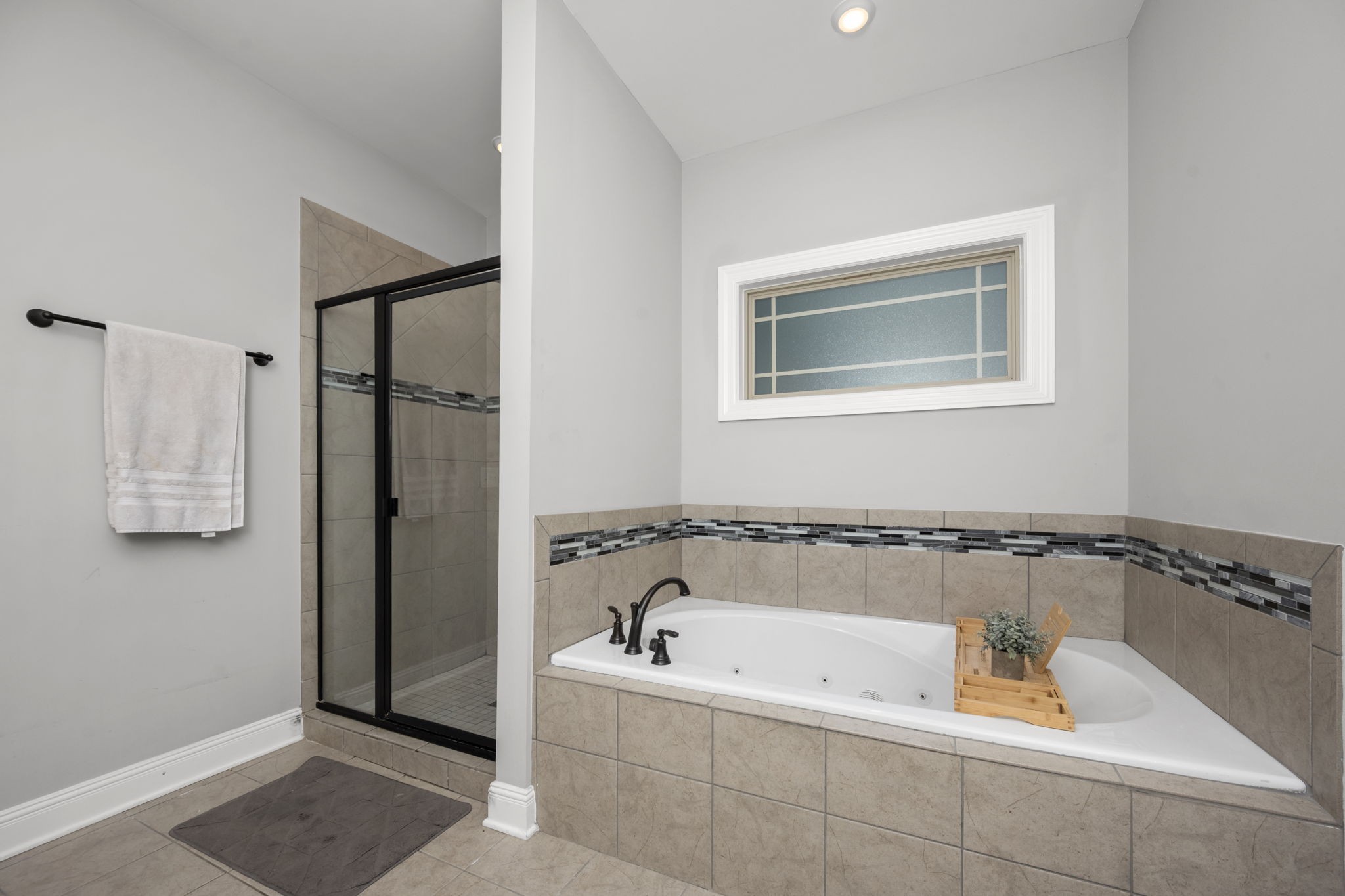 810 Walnut Grove Road Christiana, TN 37037 - Photo 29 of 48 a bathroom with a tub and a shower