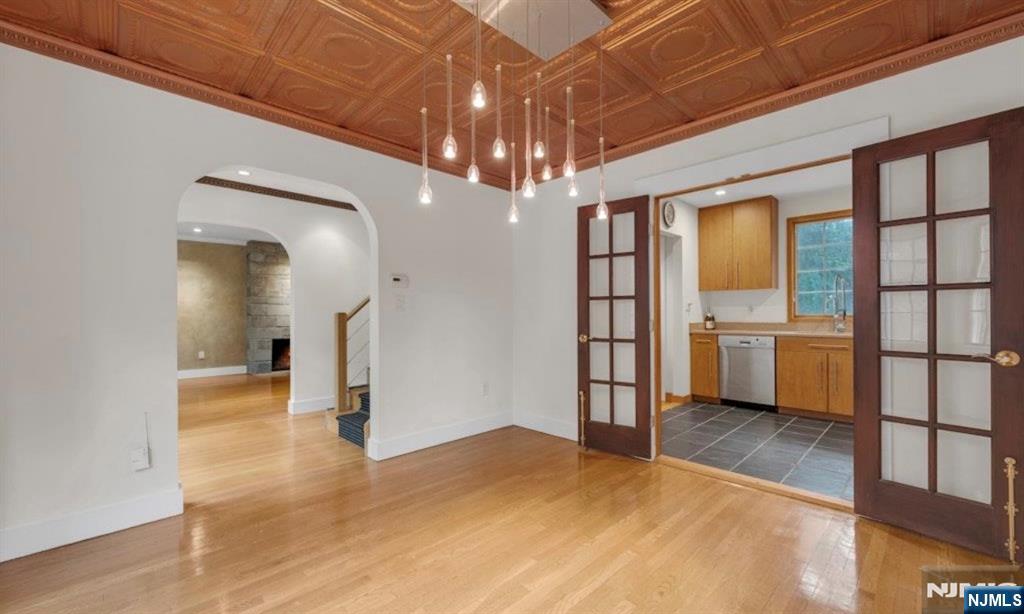 278 Maple Street Haworth, NJ 07641 - Photo 12 of 37 a view of a room with a chandelier fan and windows