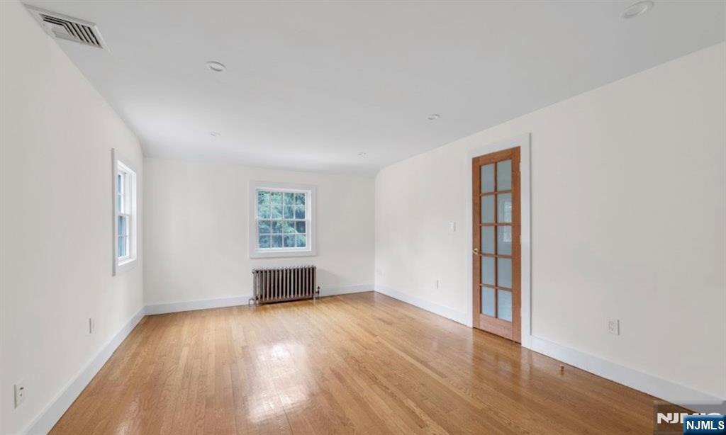 278 Maple Street Haworth, NJ 07641 - Photo 21 of 37 wooden floor in an empty room with a window