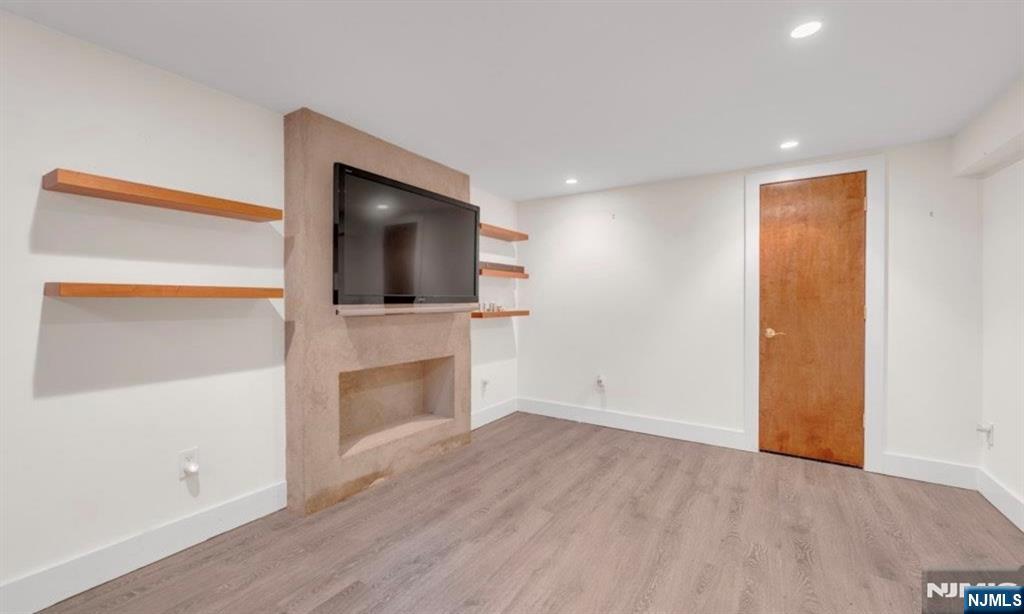 278 Maple Street Haworth, NJ 07641 - Photo 26 of 37 a view of a livingroom with an empty space and a fireplace