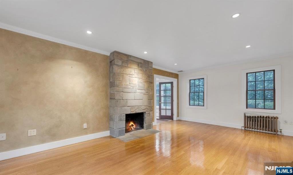 278 Maple Street Haworth, NJ 07641 - Photo 4 of 37 a view of an empty room with a fireplace and a window