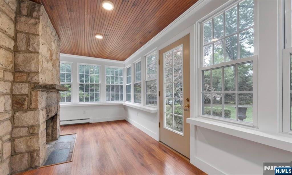 278 Maple Street Haworth, NJ 07641 - Photo 8 of 37 a view of empty room with wooden floor and fan