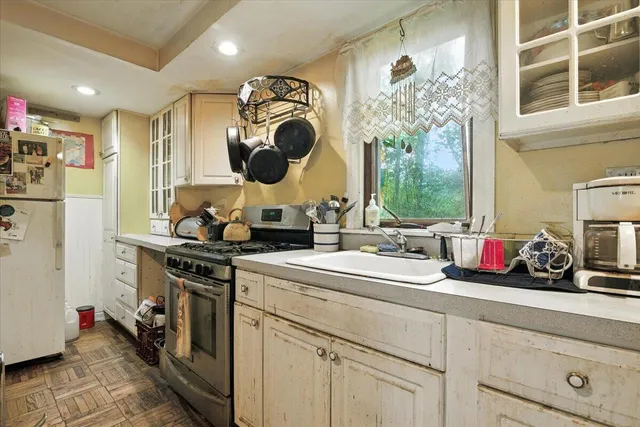 a kitchen with a sink and cabinets