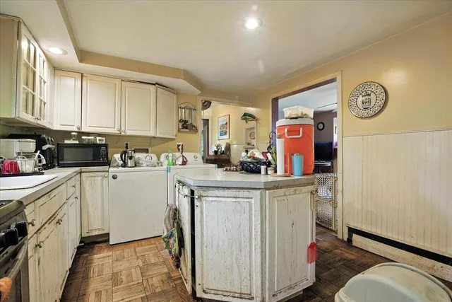 a kitchen with a sink and cabinets