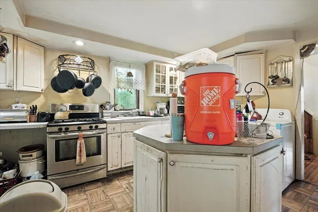 a view of front door with furniture and a window
