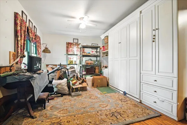 a view of hallway with wooden floor