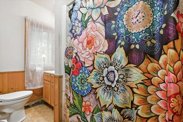 a view of a house with a yard and a garden