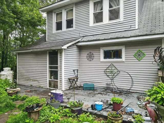 a car parked in front of a house with a yard