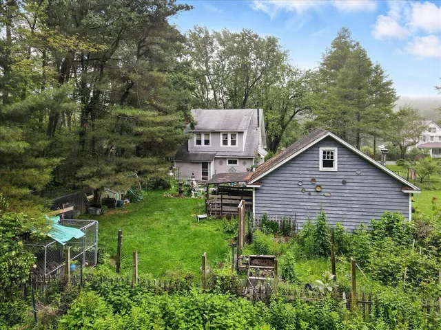 a backyard of a house with lots of green space