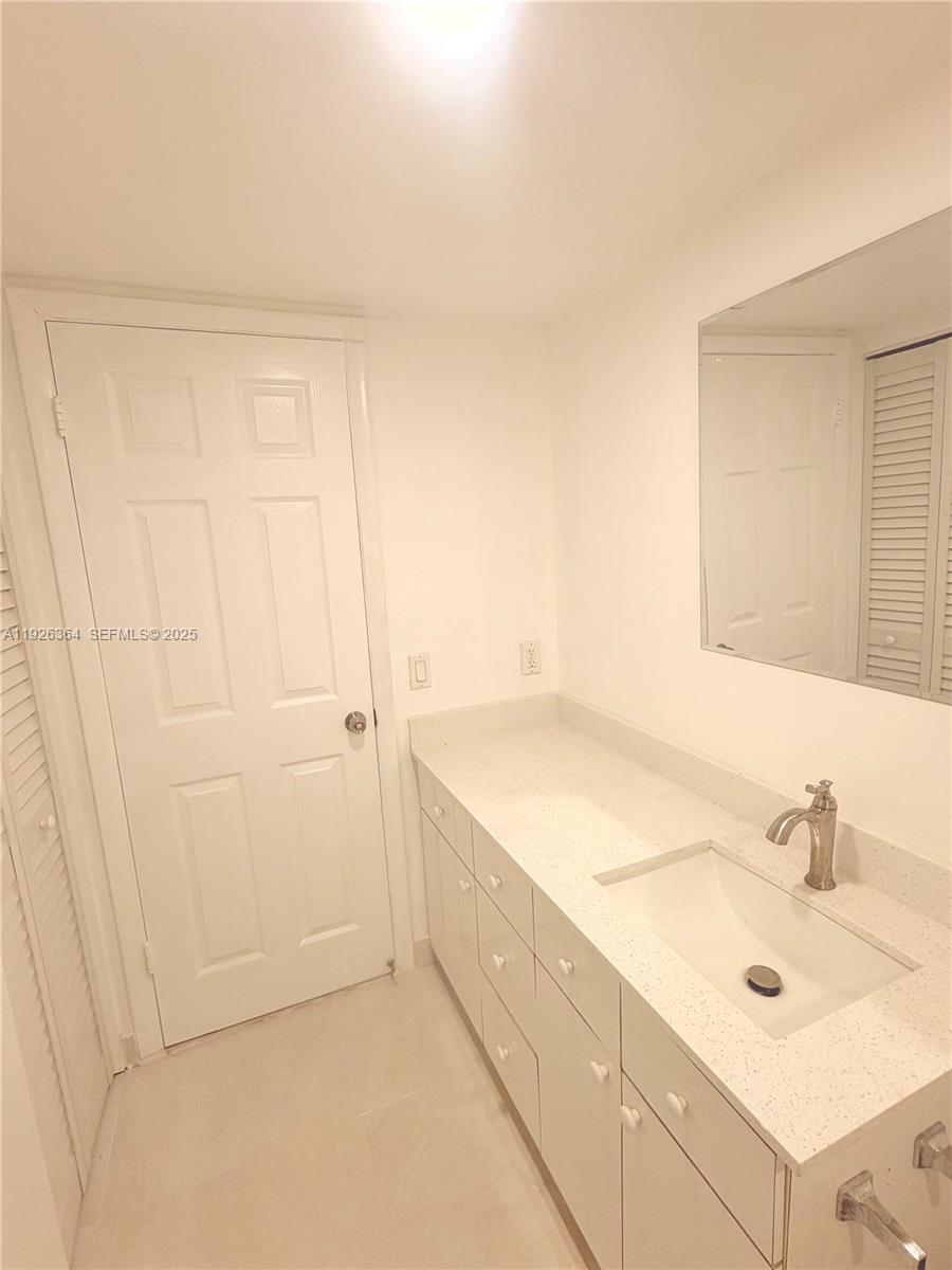 7208 Fairway Drive, Unit I20 Miami Lakes, FL 33014 - Photo 12 of 22 a bathroom with a sink and a mirror