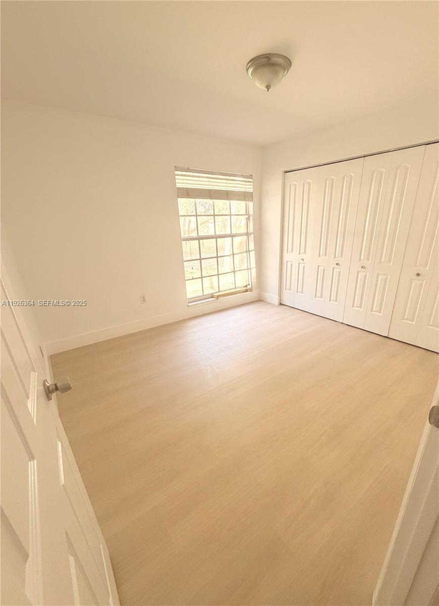 7208 Fairway Drive, Unit I20 Miami Lakes, FL 33014 - Photo 15 of 22 a view of an empty room with a window