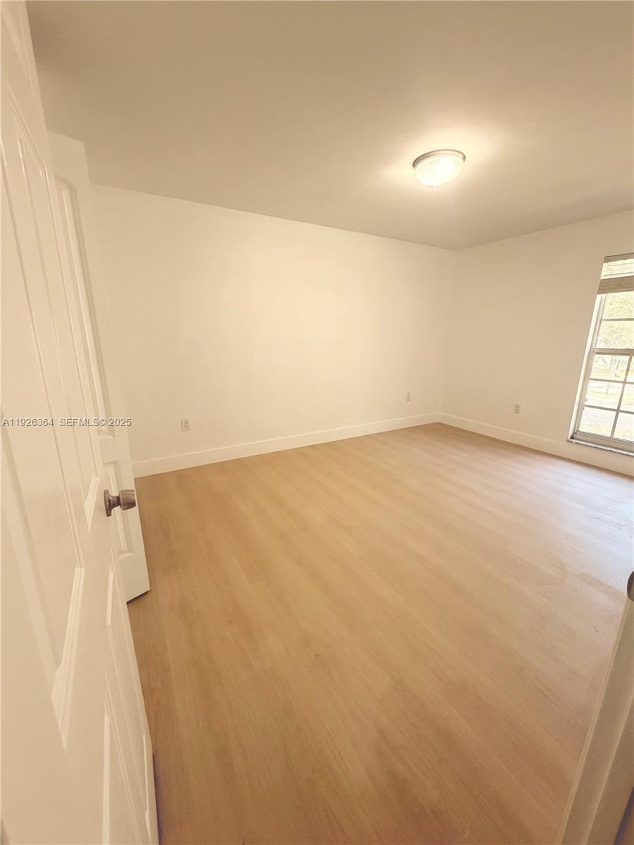 7208 Fairway Drive, Unit I20 Miami Lakes, FL 33014 - Photo 18 of 22 a view of a room with racks on the wall