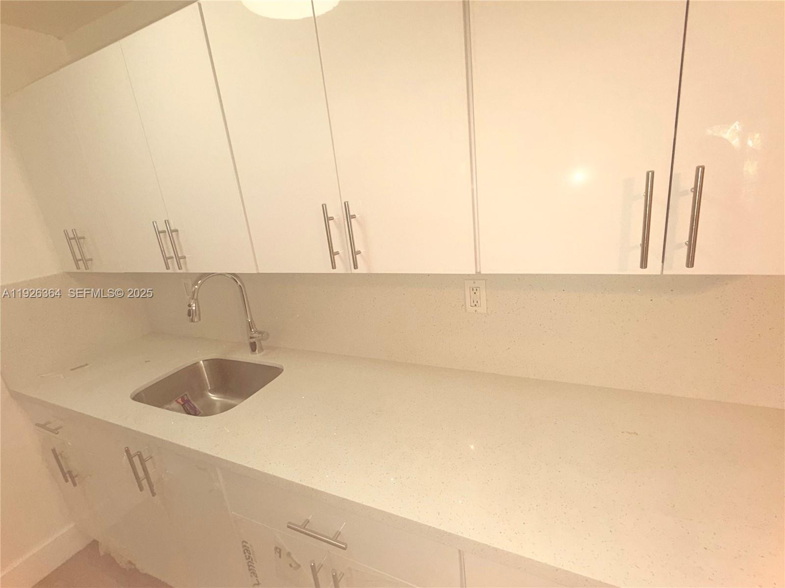 7208 Fairway Drive, Unit I20 Miami Lakes, FL 33014 - Photo 8 of 22 a bathroom with a sink and a vanity